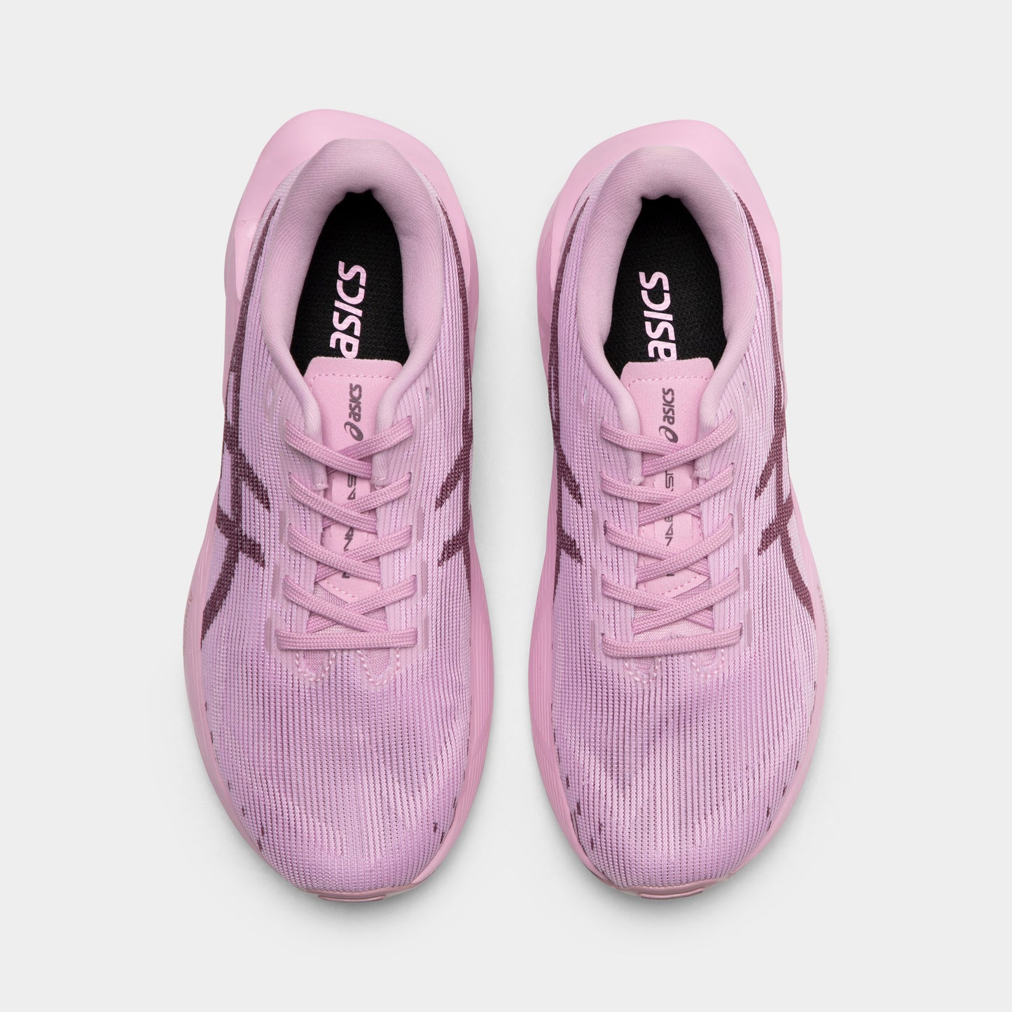 ASICS Juniors' Novablast 5. Top view of hazy lilac and dark prune junior running shoes showing tonal laces, padded tongues and mesh toe boxes.