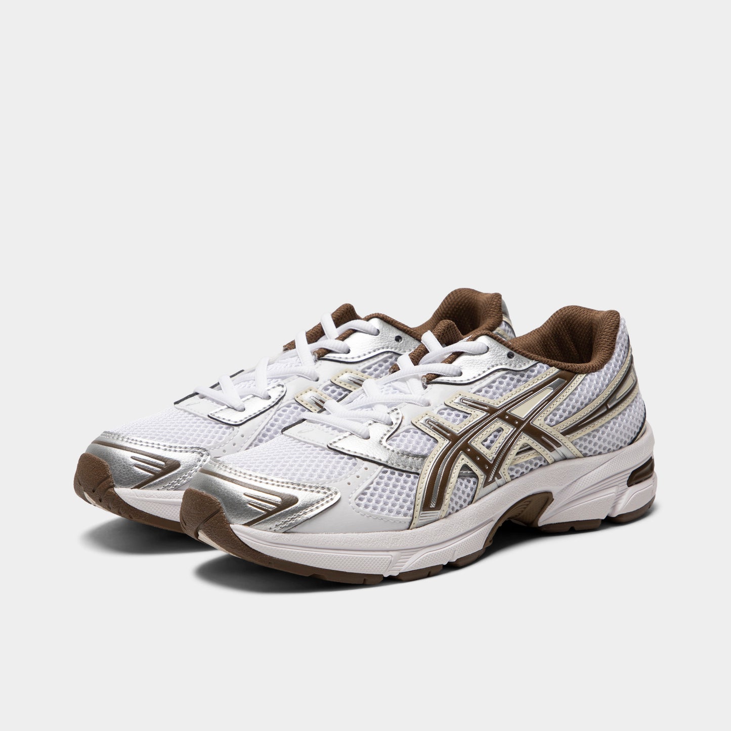 ASICS GEL-1130 GS. Three-quarter view of white and clay canyon sneakers with white laces, layered overlays and brown ASICS branding.