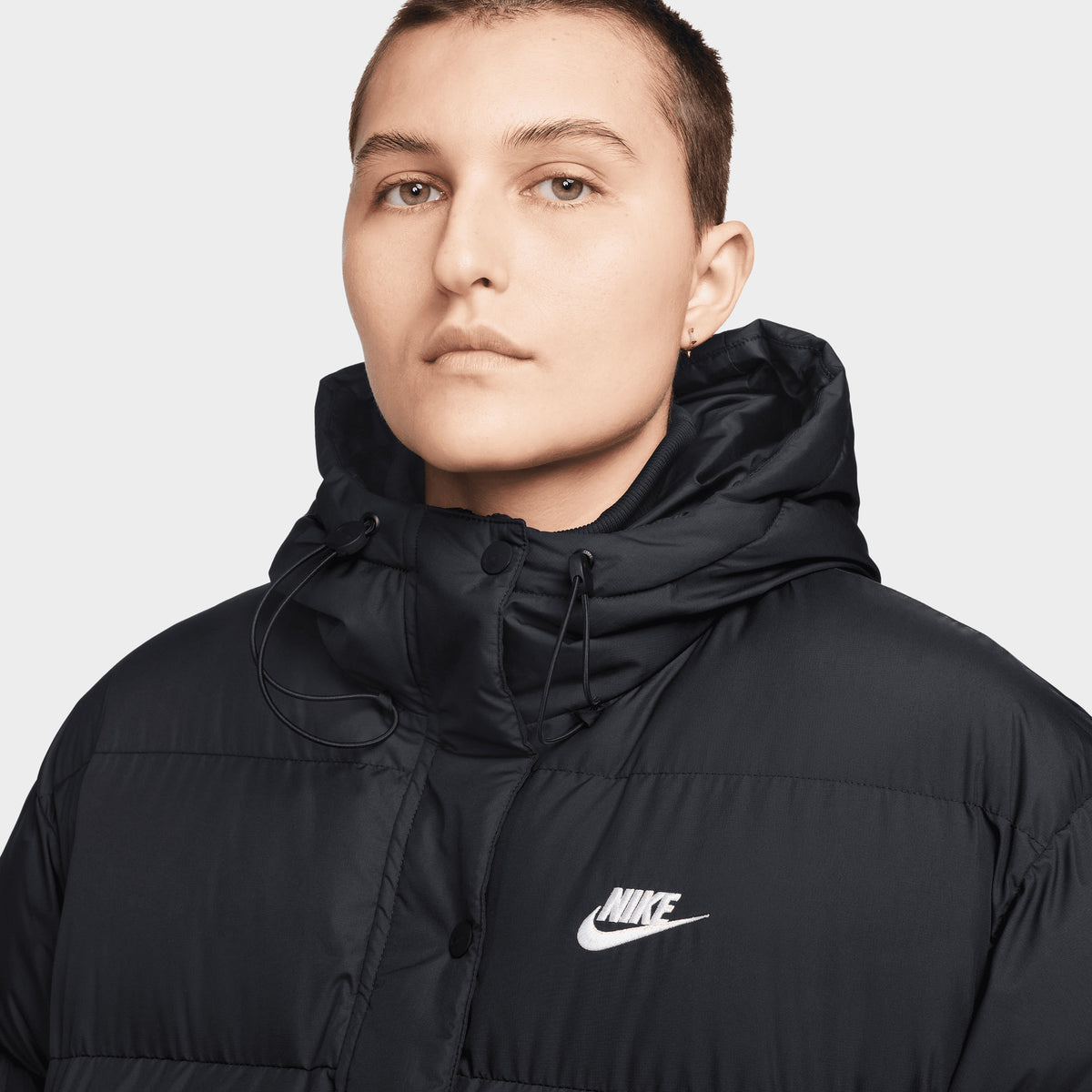 Nike puffer jacket black and white on sale