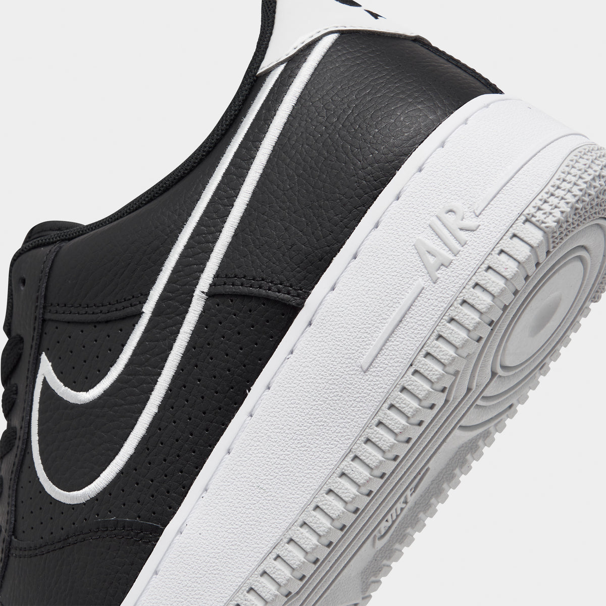 Nike air force 1 black and white sole discount