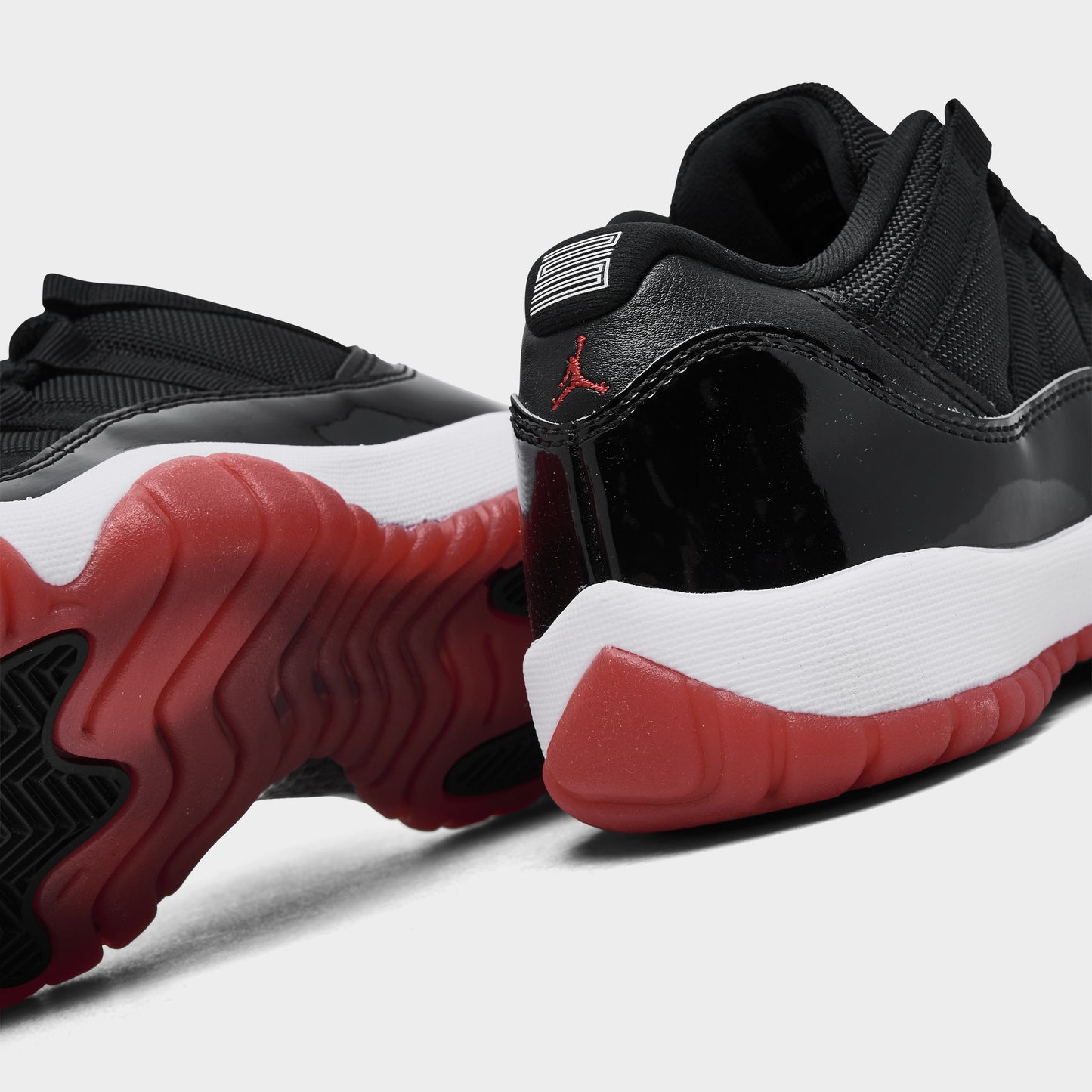 Jordan 11 Retro Low GS Black / Varsity Red - White