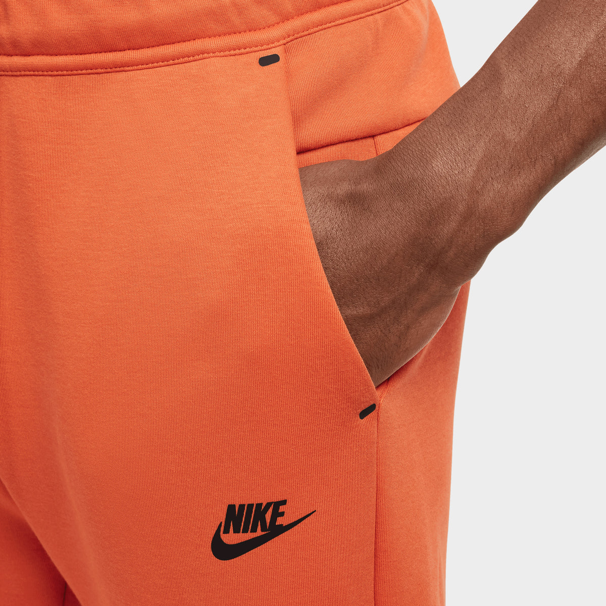 Orange joggers nike best sale