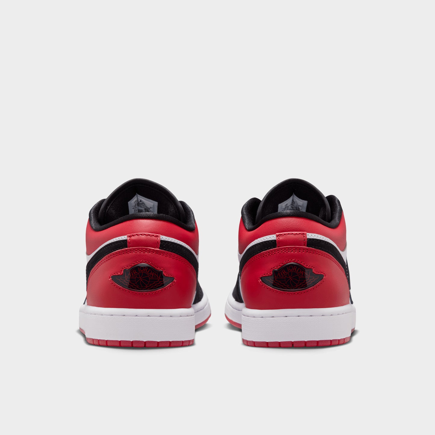 Jordan 1 Low Blanc / Noir - Rouge vif