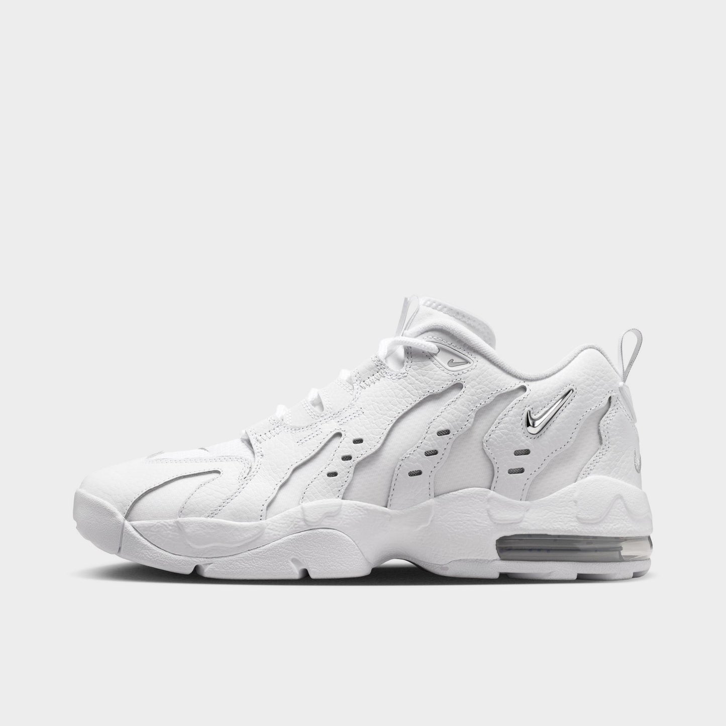 Nike Air DT Max '96 Low. Side view of white and metallic silver sneaker with sculpted overlays, perforated panels and visible Air cushioning.