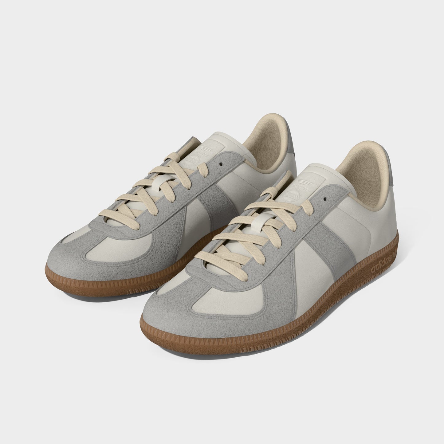 adidas BW Army. Three-quarter view of chalk white, clear granite and gum sneakers with tonal laces, layered panels and gum soles.