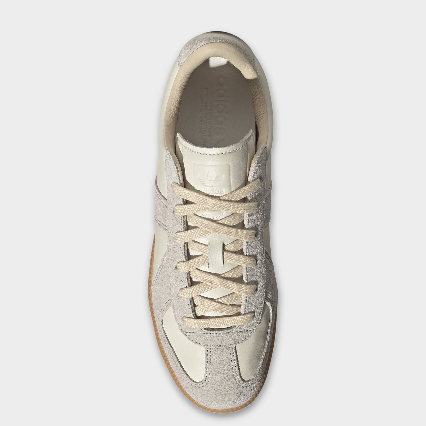 adidas BW Army. Top view of chalk white, clear granite and gum sneaker showing beige laces, padded tongue and cream-coloured lining.