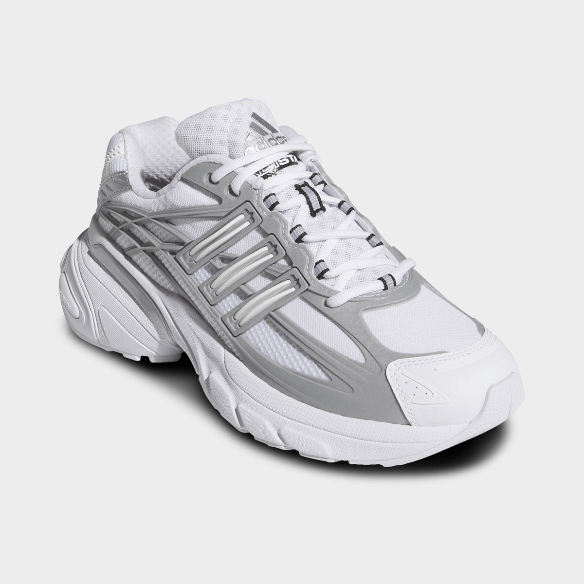 adidas Adistar XLG 2.0. Three-quarter view of footwear white and silver metallic sneakers with white laces, layered uppers and chunky soles.