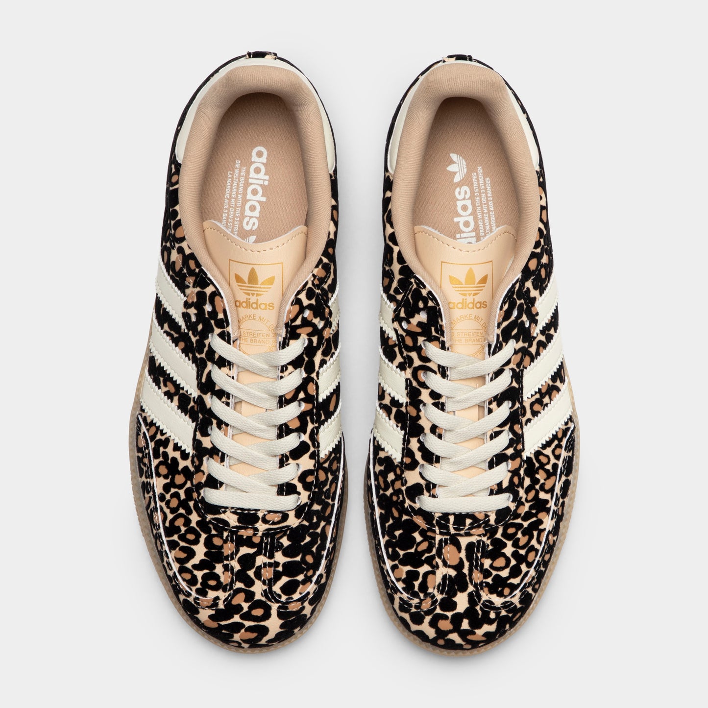 adidas Juniors' Samba OG J. Top view of sand strata, ivory and gum junior sneakers showing white laces, patterned uppers and padded collars.