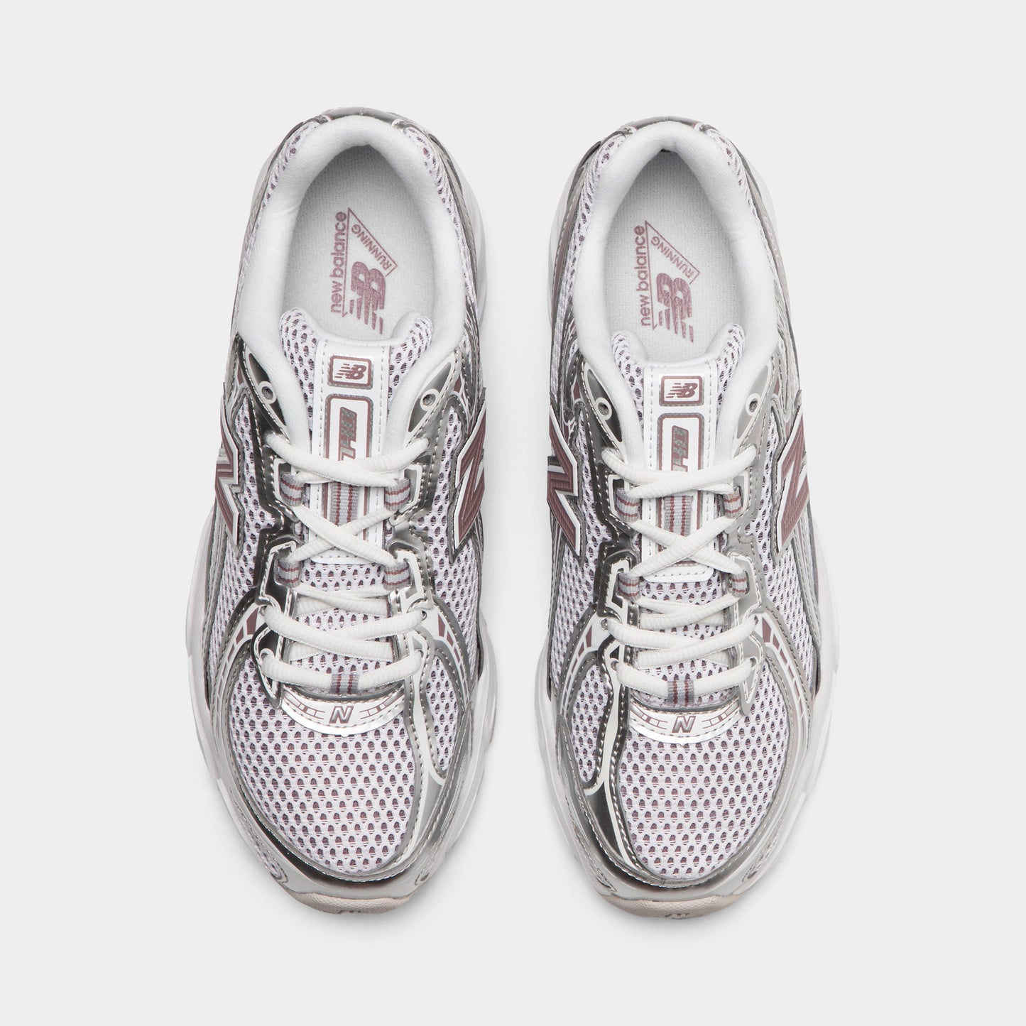 New Balance 740. Top view of silver metallic, raincloud and pebble sneakers showing grey laces, padded tongues and mesh toe boxes.