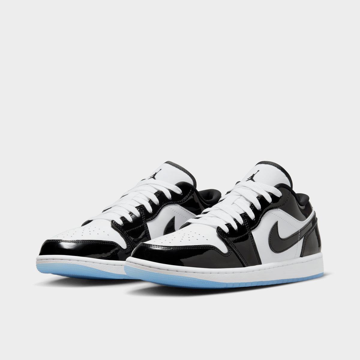 white and black jordans low top