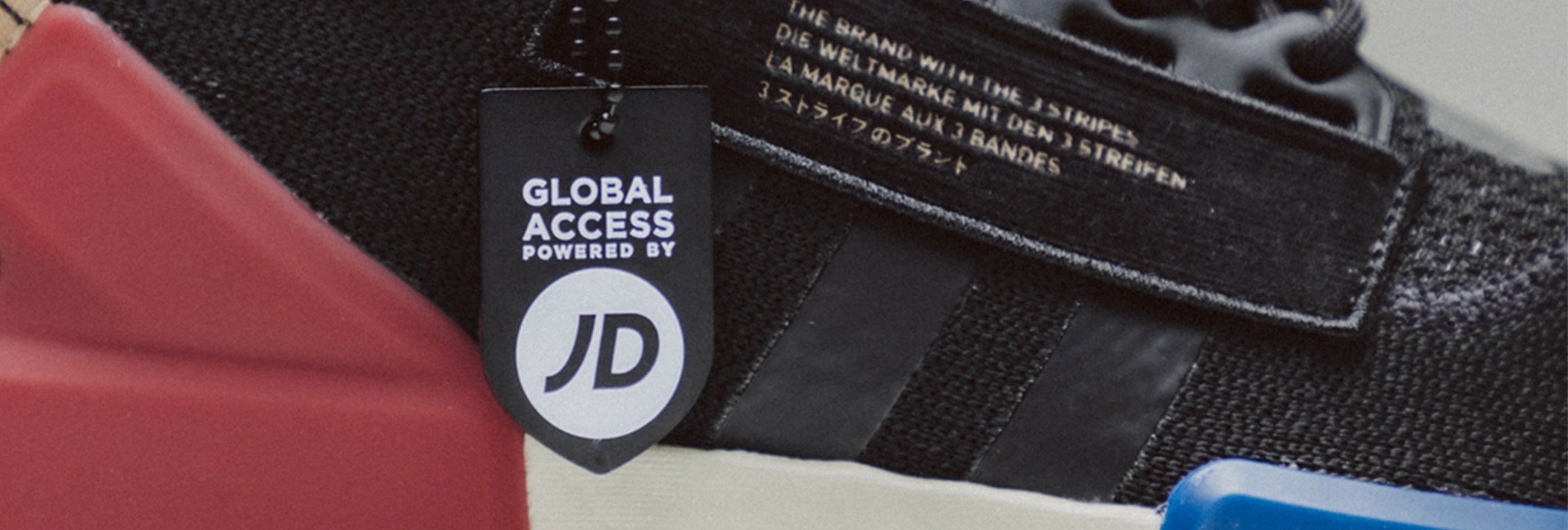 men's adidas nmd rq_v2 close up with jd global access tag