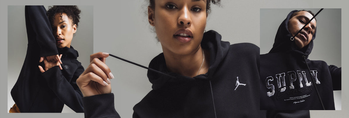 A man and woman wearing cozy fall hoodies from Hoodrich, Nike, and Jordan.