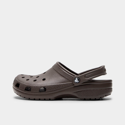 Crocs Classic Clog. Side view of espresso clog with ventilation holes, pivoting heel strap and matching textured sole.