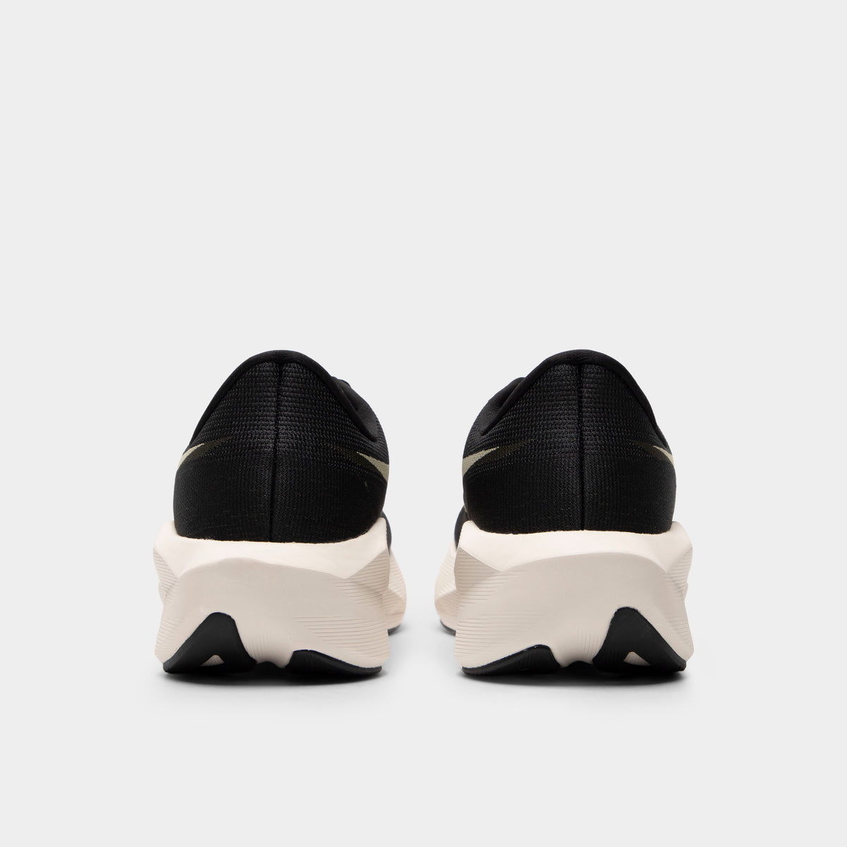 ASICS Novablast 6. Rear view of black and khaki running shoes with padded heel panels, white midsoles and black outsole sections.