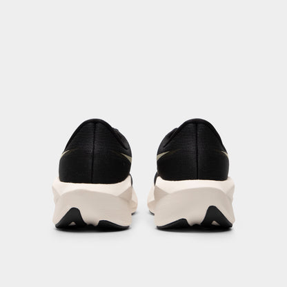 ASICS Novablast 6. Rear view of black and khaki running shoes with padded heel panels, white midsoles and black outsole sections.