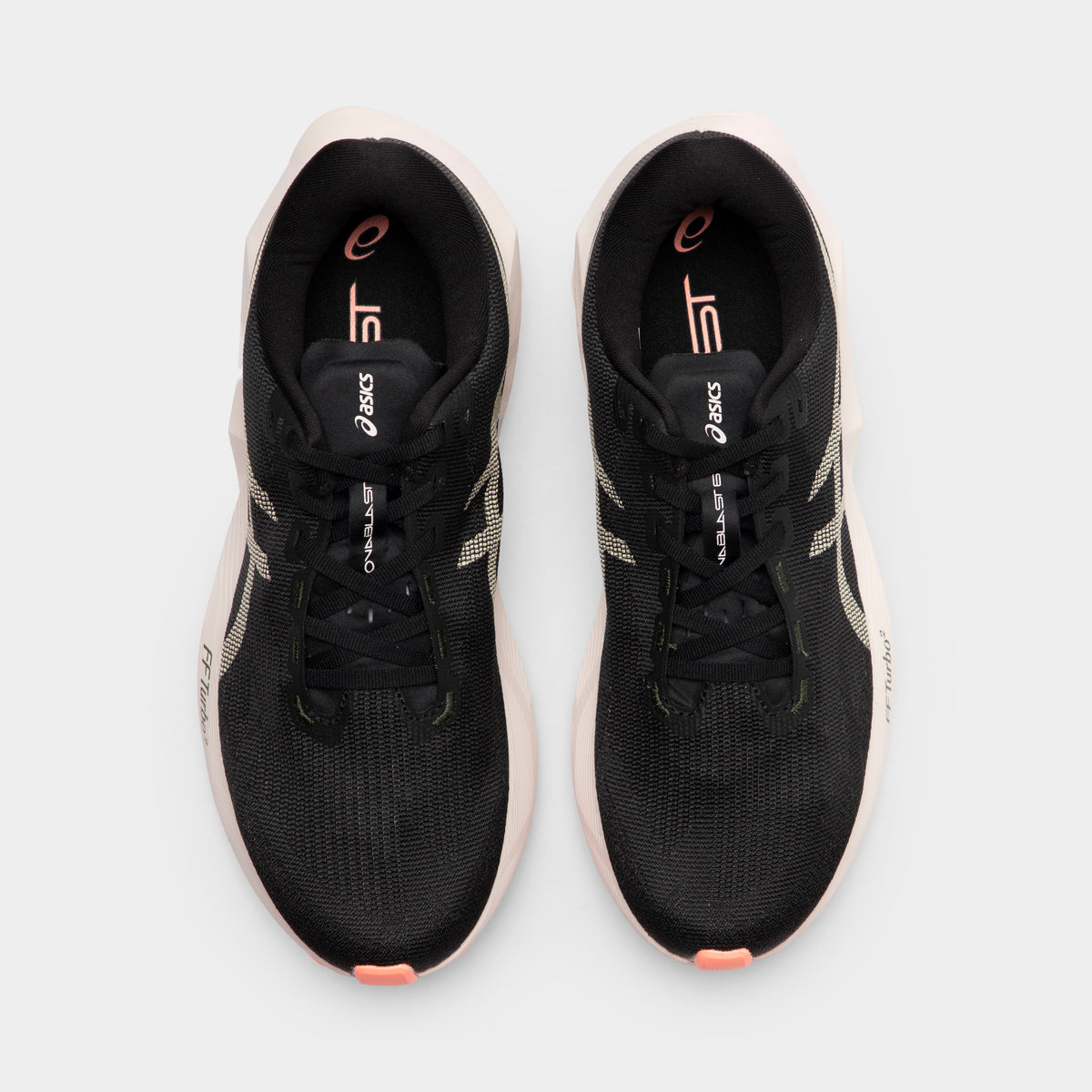 ASICS Novablast 6. Top view of black and khaki running shoes showing black laces, padded tongues and orange insole details.