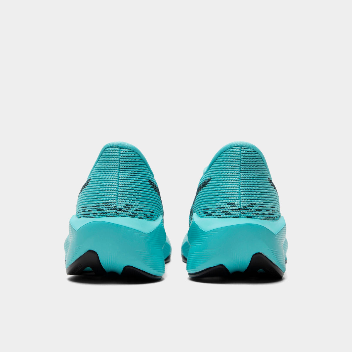 ASICS Juniors' Novablast 5. Rear view of ice mint and black junior running shoes with padded heel panels and black outsole sections.