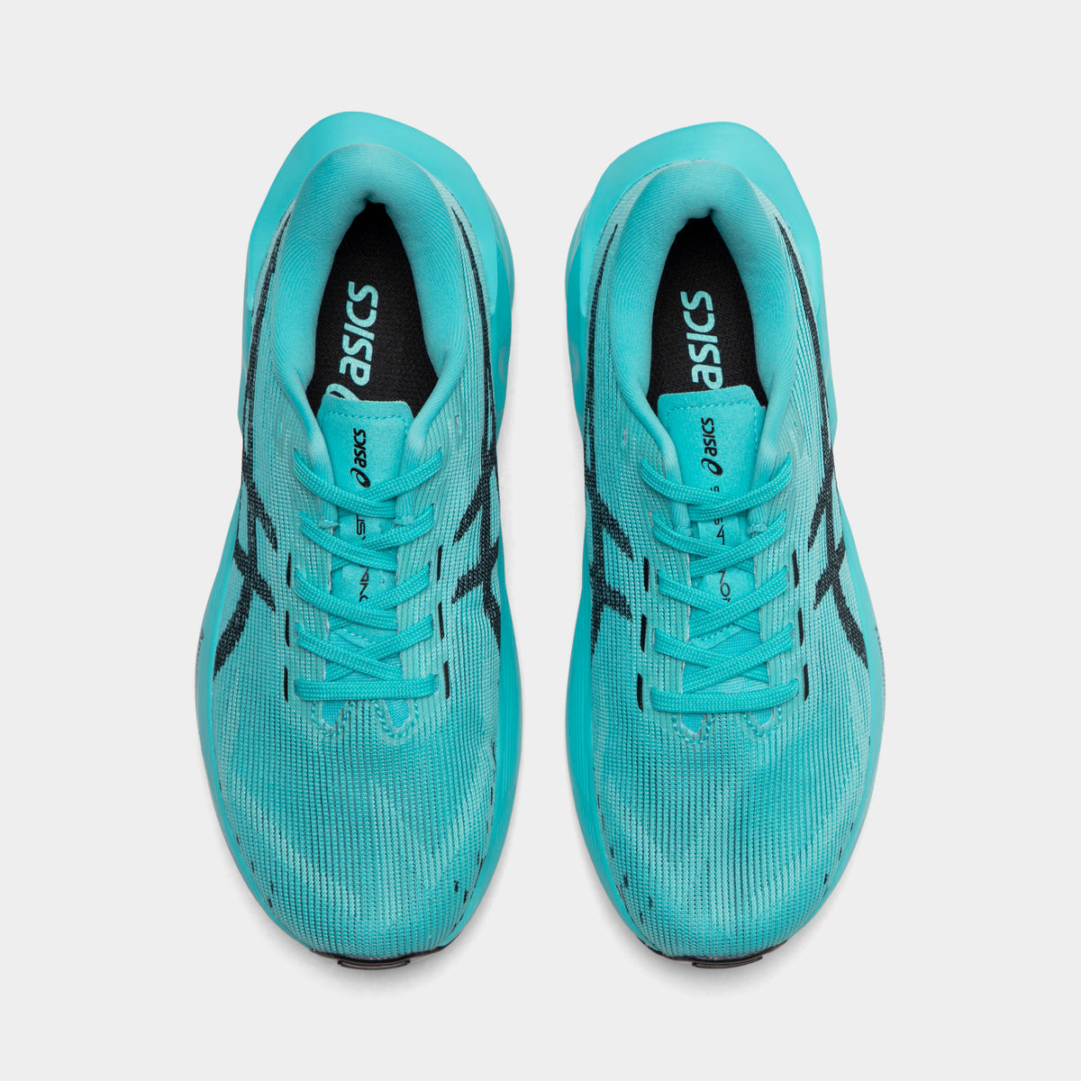 ASICS Juniors' Novablast 5. Top view of ice mint and black junior running shoes showing tonal laces, padded tongues and mesh toe boxes.