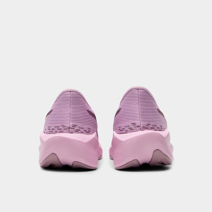 ASICS Juniors' Novablast 5. Rear view of hazy lilac and dark prune junior running shoes with padded heel panels and darker outsole sections.