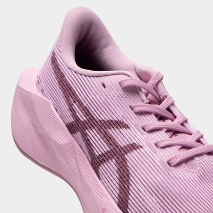 ASICS Juniors' Novablast 5. Close-up of hazy lilac and dark prune junior running shoe showing tonal laces, mesh panels, dark ASICS stripes and padded collar.
