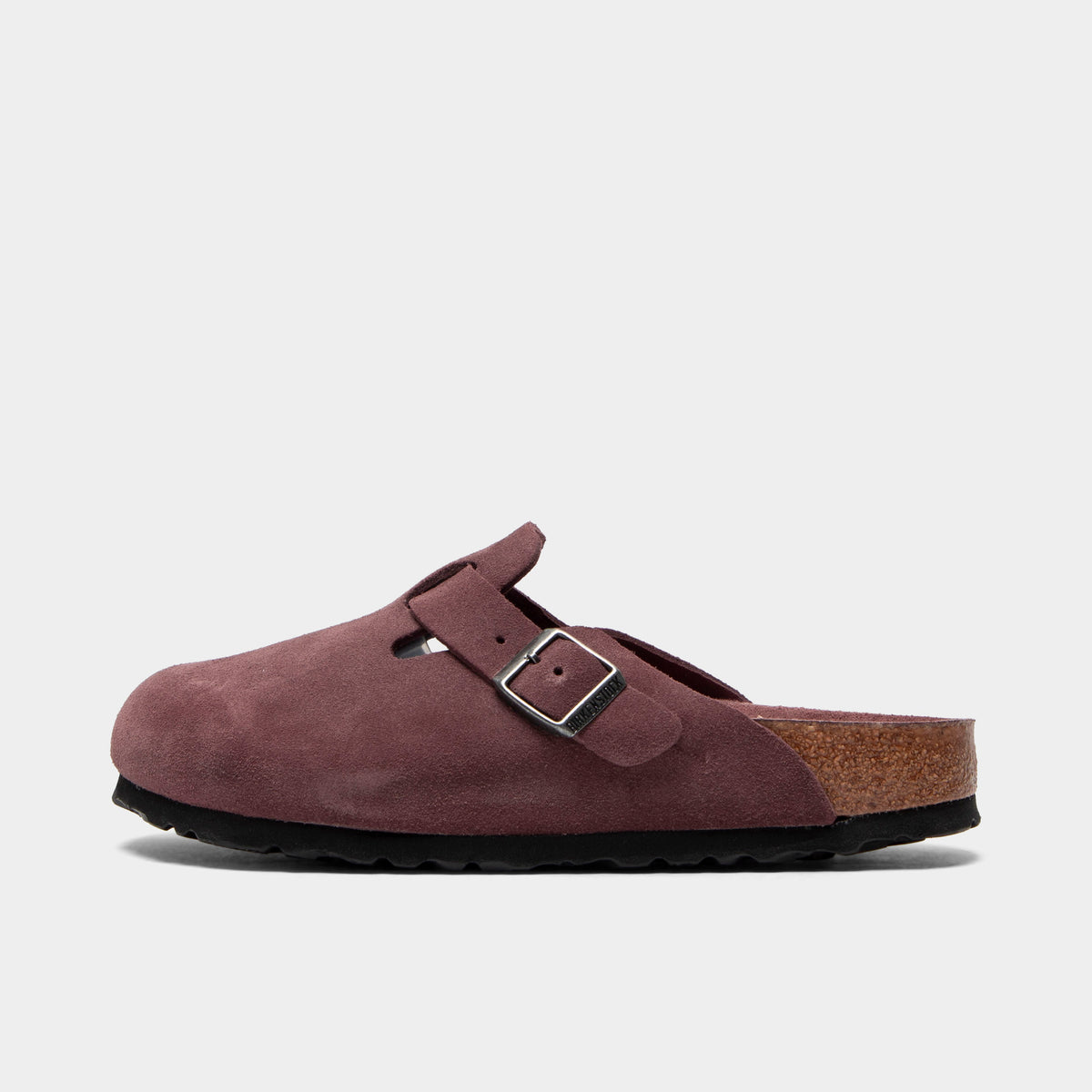Birkenstock Women's Boston. Side view of pepper clogs with suede uppers, adjustable buckles, cork footbeds and black soles.