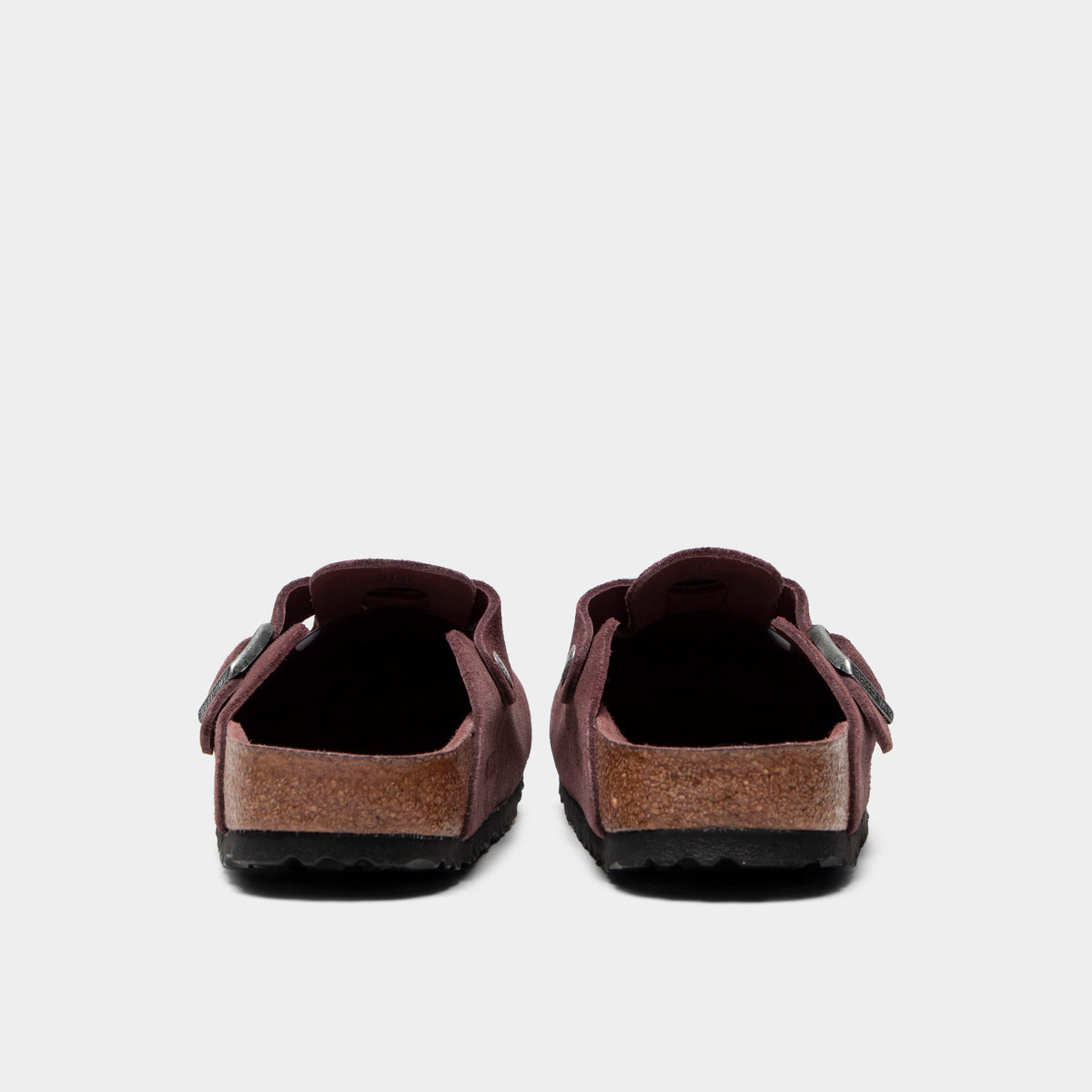 Birkenstock Women's Boston. Rear view of pepper clogs with rounded heels, suede uppers and black soles.