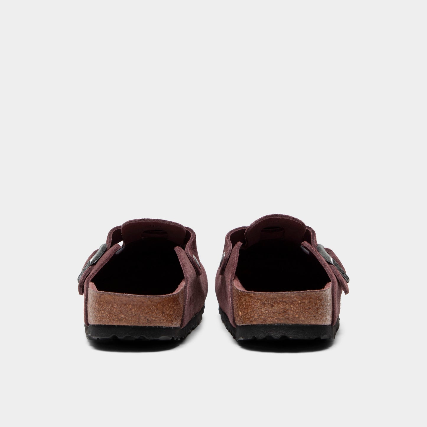 Birkenstock Women's Boston. Rear view of pepper clogs with rounded heels, suede uppers and black soles.