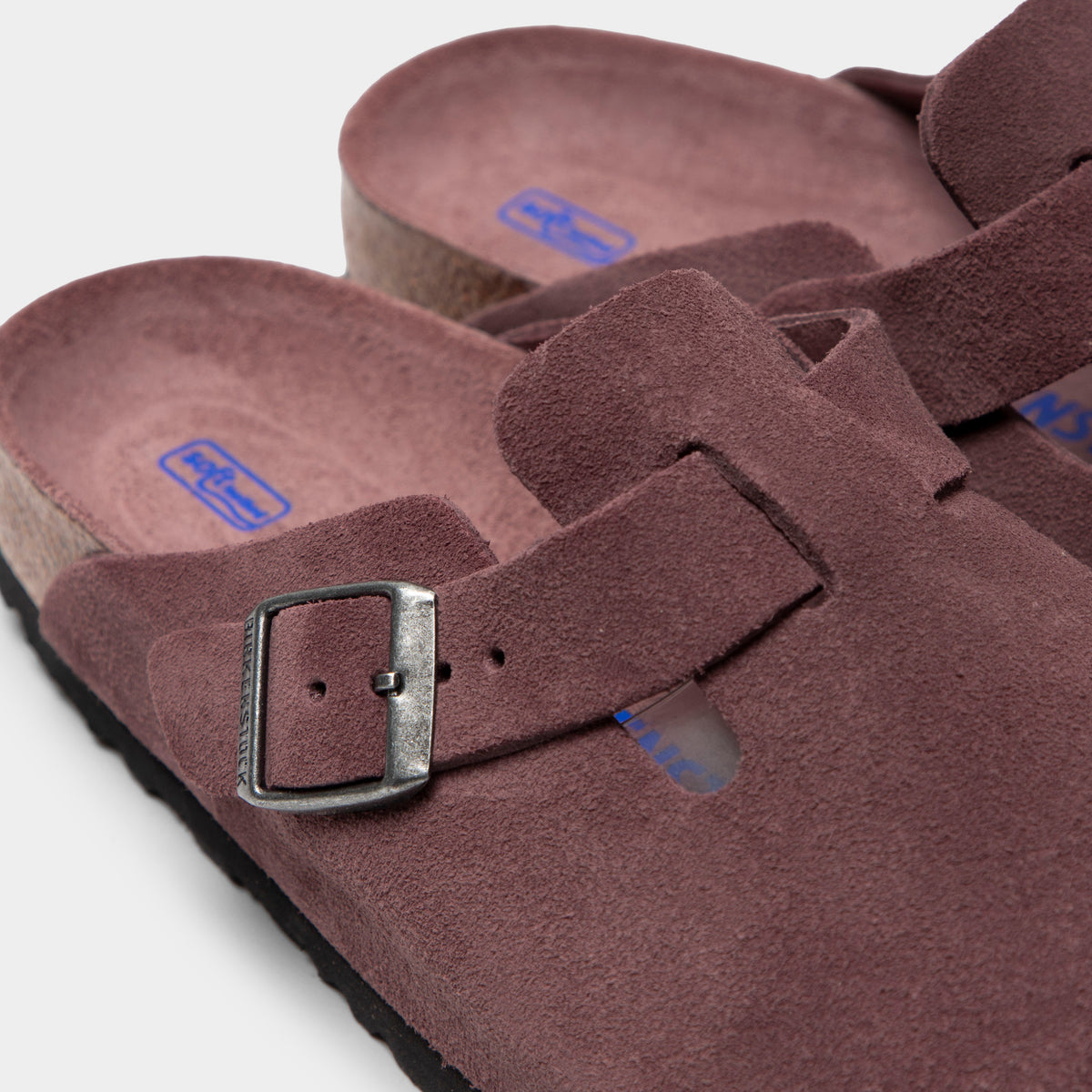 Birkenstock Women's Boston. Close-up of pepper clog showing suede upper, metal buckle, adjustable strap and cork footbed edge.