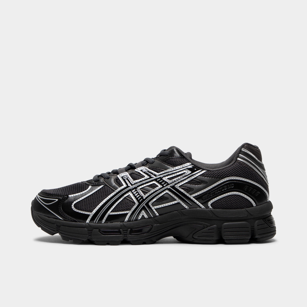 ASICS Gel-Stratus MC. Side view of graphite grey and black sneaker with layered mesh panels, grey ASICS stripes and sculpted sole.