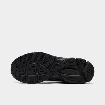 ASICS Gel-Stratus MC. Bottom view of graphite grey and black sneaker showing black segmented outsole with textured tread pattern.