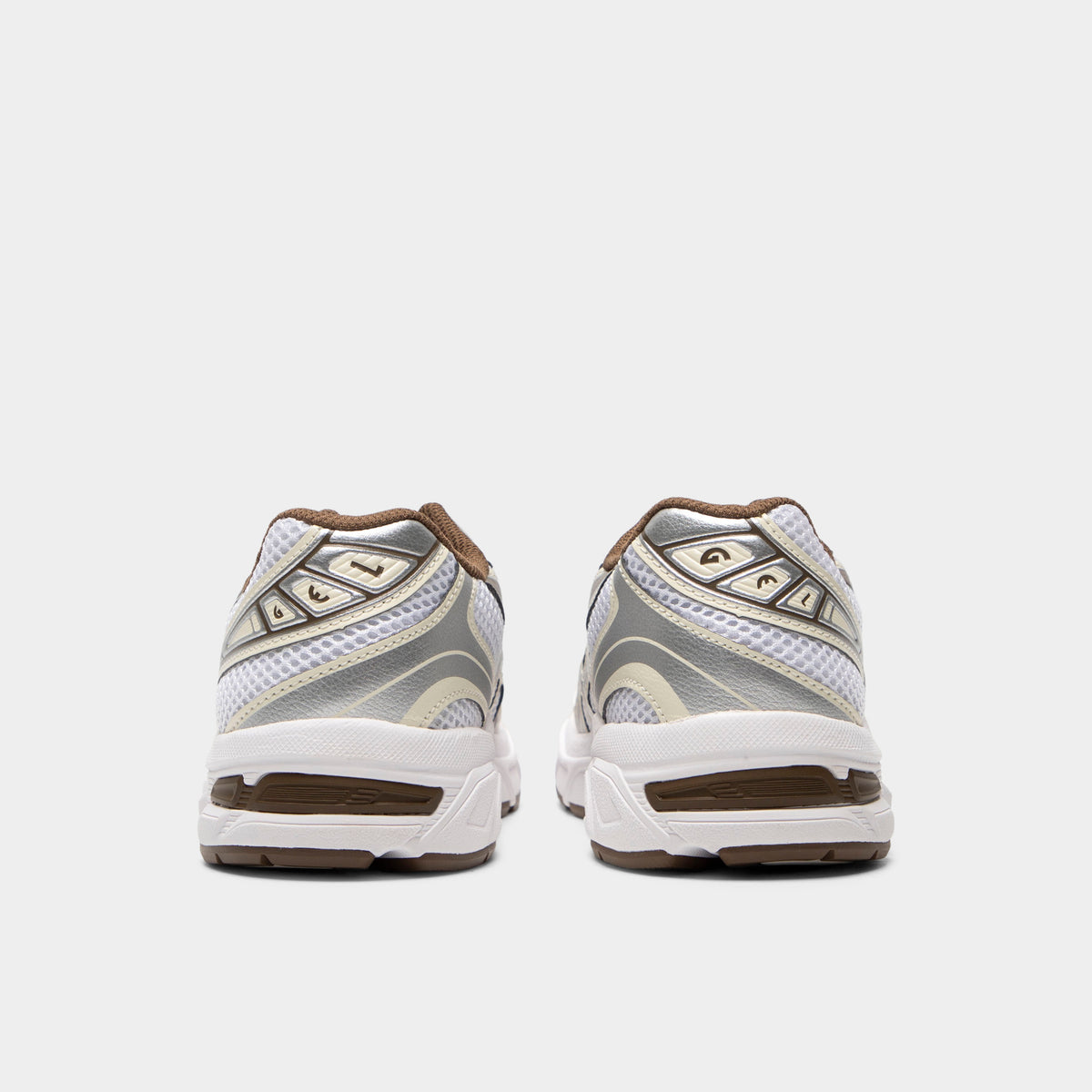 ASICS GEL-1130 GS. Rear view of white and clay canyon sneakers with padded heel panels and brown outsole accents.