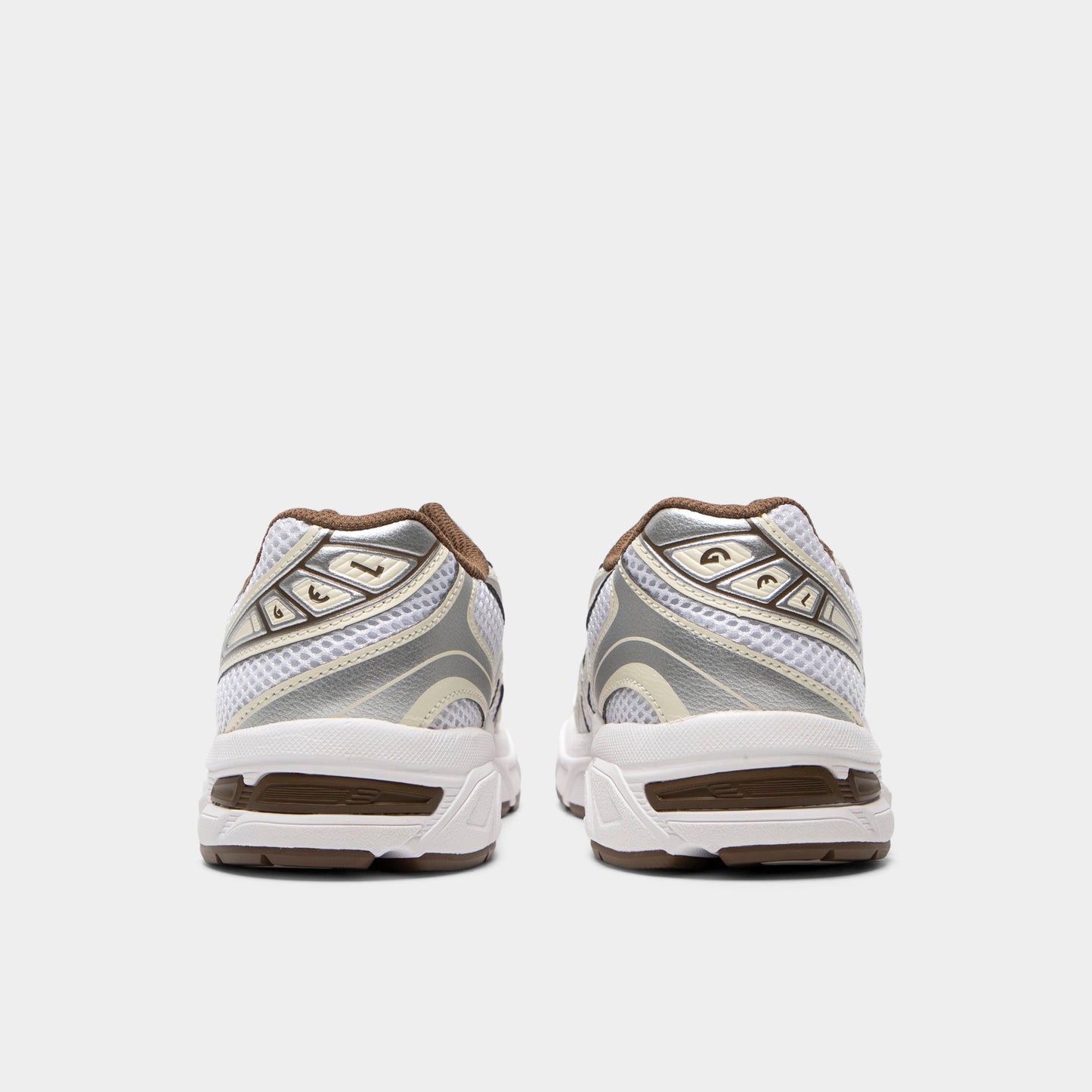 ASICS GEL-1130 GS. Rear view of white and clay canyon sneakers with padded heel panels and brown outsole accents.