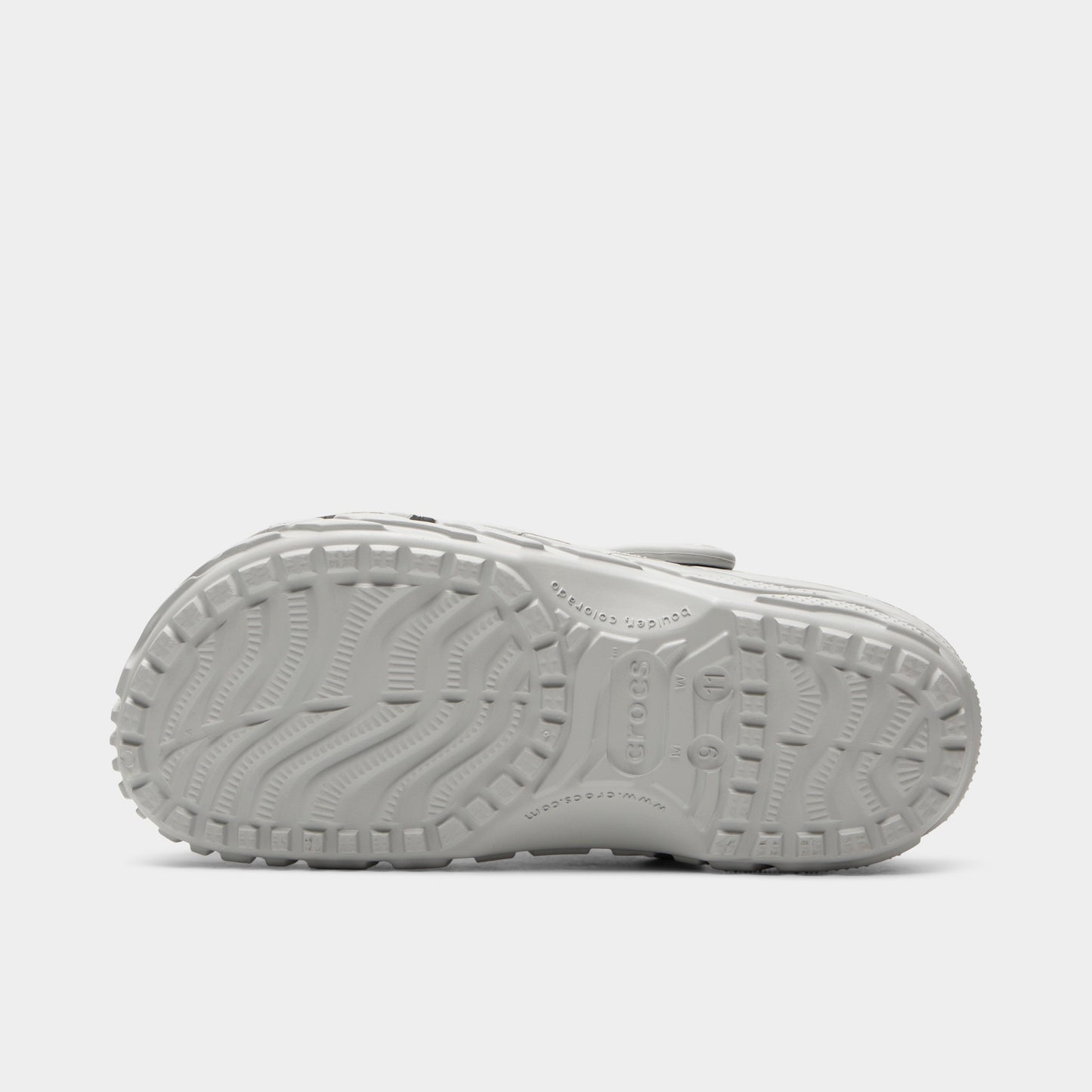 Crocs Classic Erosion Clog. Bottom view of atmosphere clog showing textured outsole with segmented tread pattern.