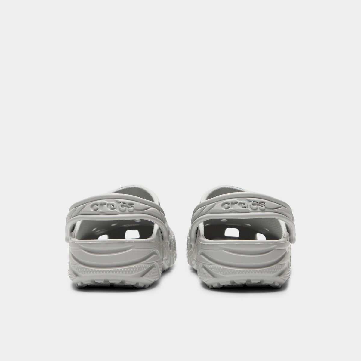 Crocs Classic Erosion Clog. Rear view of atmosphere clogs with lowered heel straps, rounded heels and textured soles.