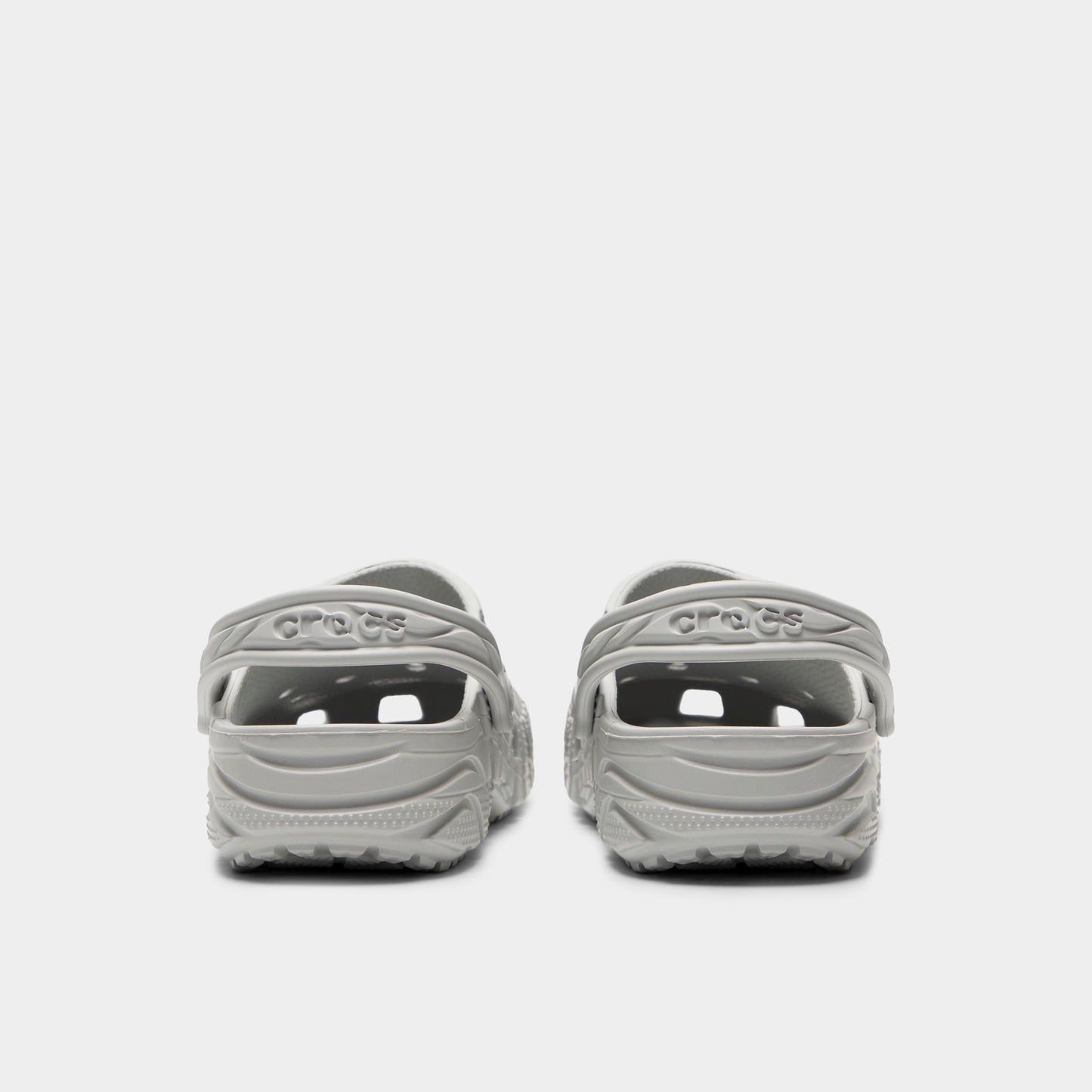 Crocs Classic Erosion Clog. Rear view of atmosphere clogs with lowered heel straps, rounded heels and textured soles.