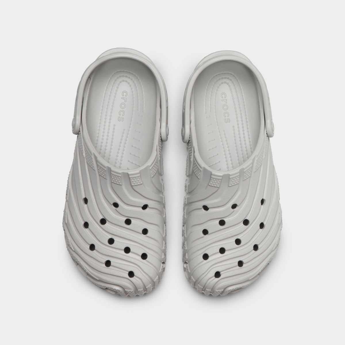 Crocs Classic Erosion Clog. Top view of atmosphere clogs showing ventilation holes, sculpted toe boxes and pivoting heel straps.