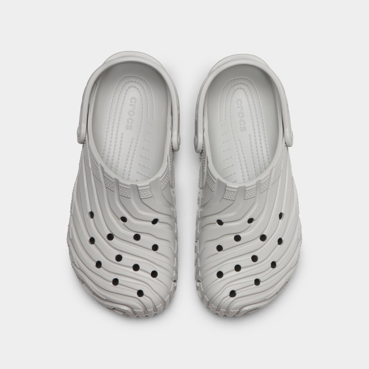 Crocs Classic Erosion Clog. Top view of atmosphere clogs showing ventilation holes, sculpted toe boxes and pivoting heel straps.