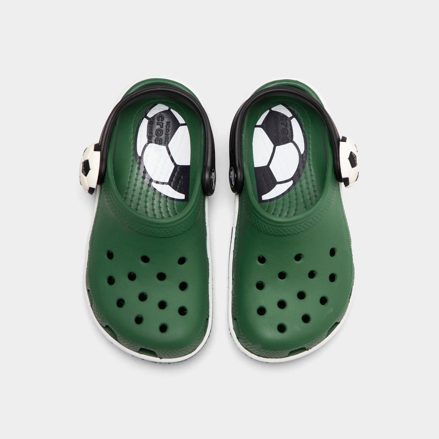 Crocs Kids' Classic Funlab Clog. Top view of turf green infant clogs showing ventilation holes, soccer ball details and pivoting heel straps.