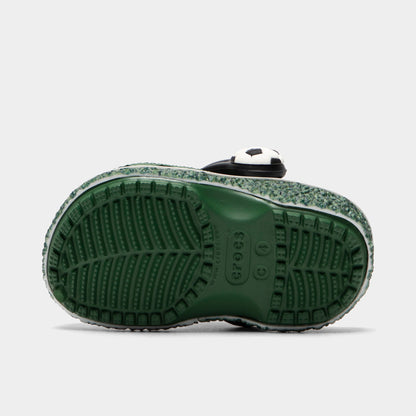 Crocs Infants' Classic Funlab Clog. Bottom view of turf green infant clog showing textured outsole with segmented tread pattern.