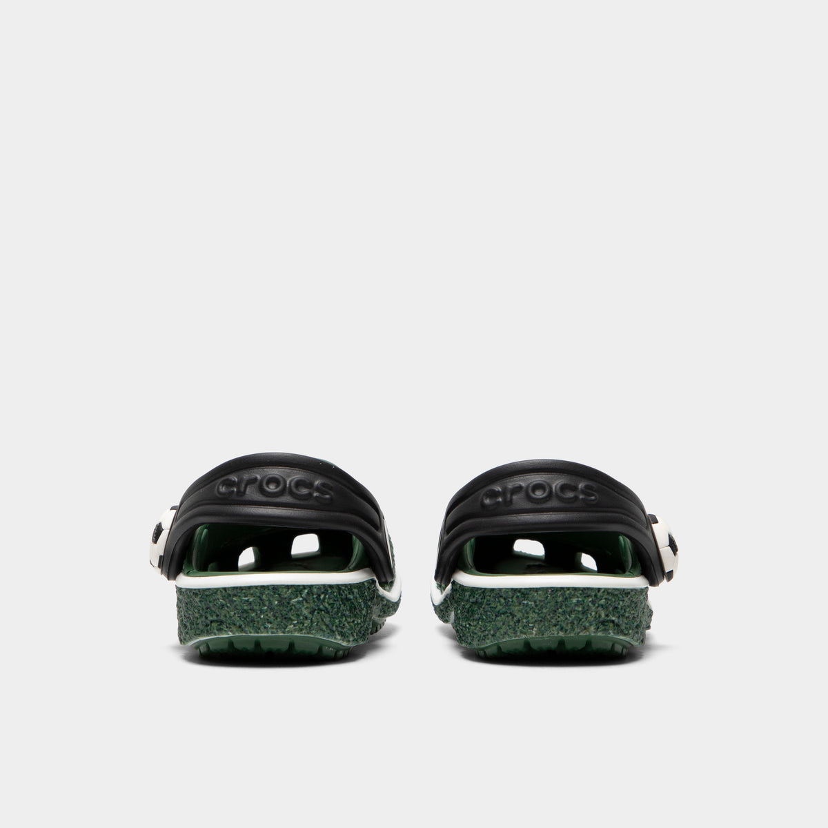 Crocs Infants' Classic Funlab Clog. Rear view of turf green infant clogs with lowered black heel straps and matching green soles.