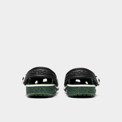 Crocs Infants' Classic Funlab Clog. Rear view of turf green infant clogs with lowered black heel straps and matching green soles.