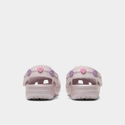 Crocs Infants' Classic Pearls and Heart Shine Clog. Rear view of grape ice infant clogs with lowered heel straps, rounded heels and matching soles.