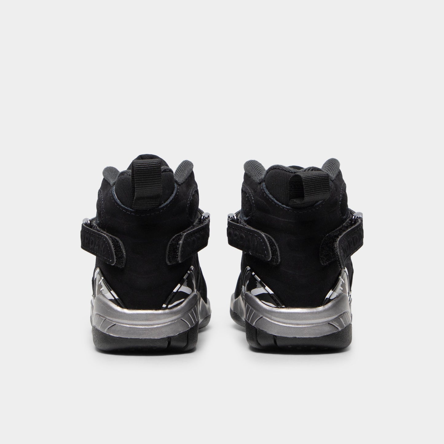 Jordan 8 Retro PS Black / White - Light Graphite. Rear view of the pair of black sneakers showing the heel pulls and Jordan branding