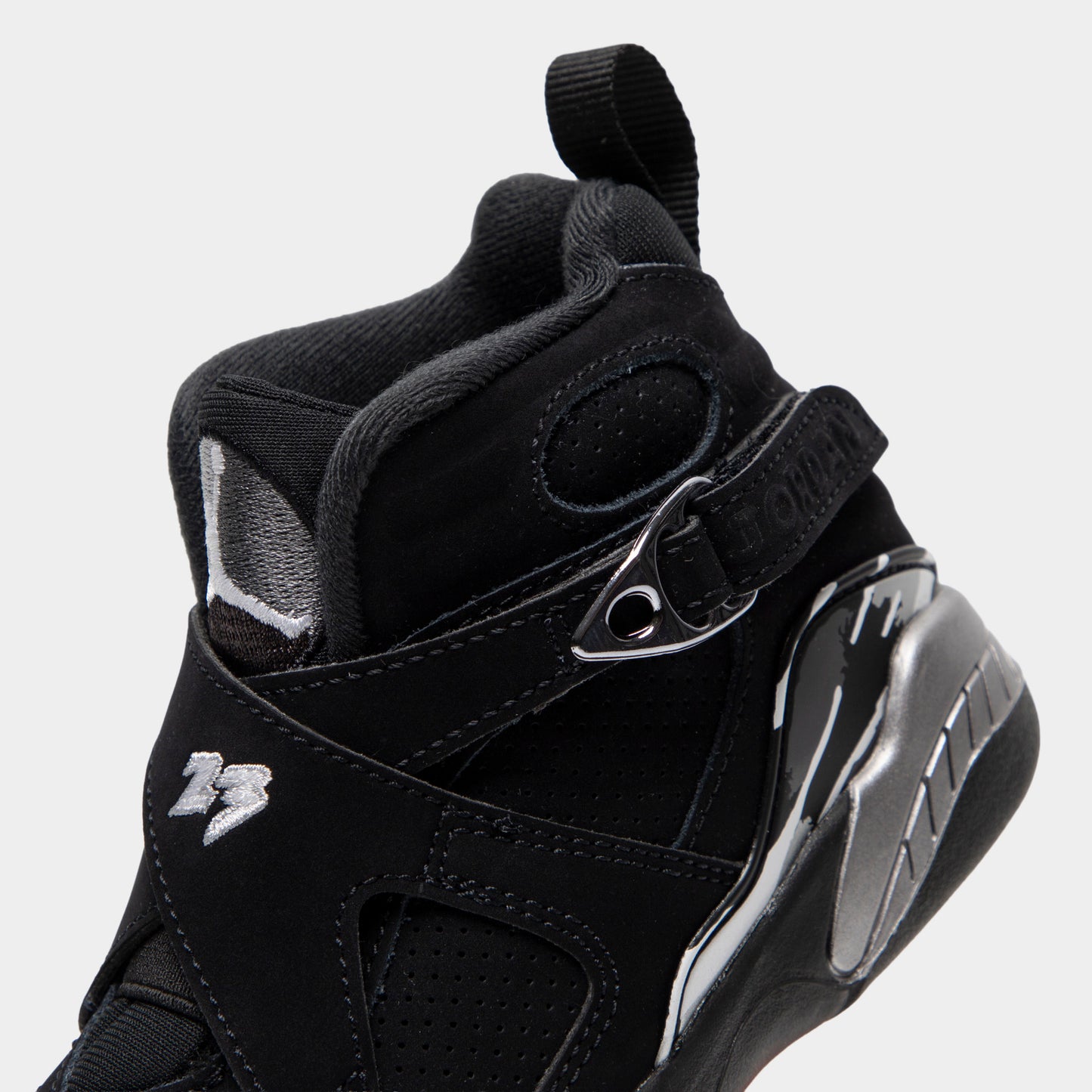 Jordan 8 Retro PS Black / White - Light Graphite. Close-up of the black sneaker collar and ankle strap with Jordan branding