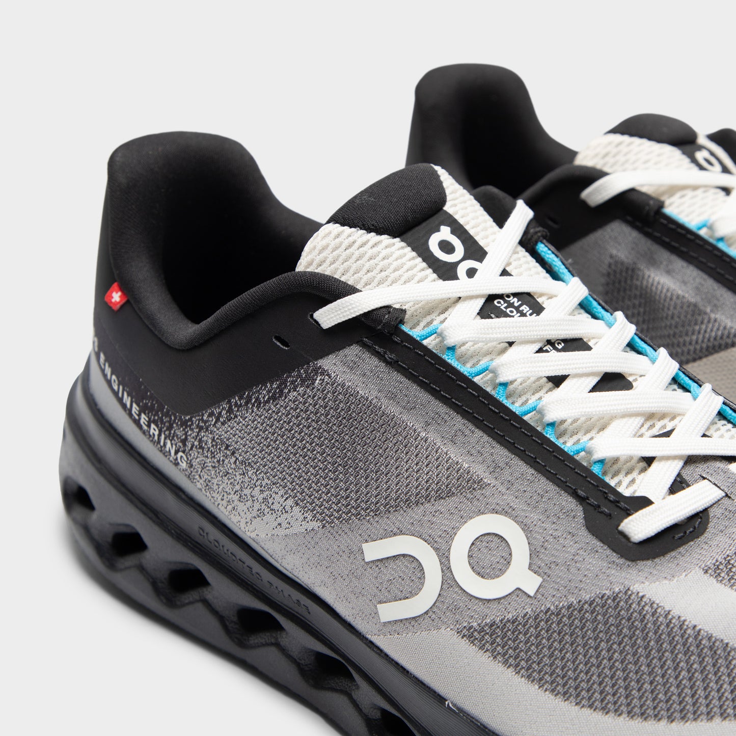 On Cloudsurfer Black / Beige