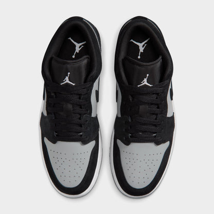 Jordan 1 Low. Top view of black, white and light smoke grey sneakers showing black laces, white toe boxes and padded collars.