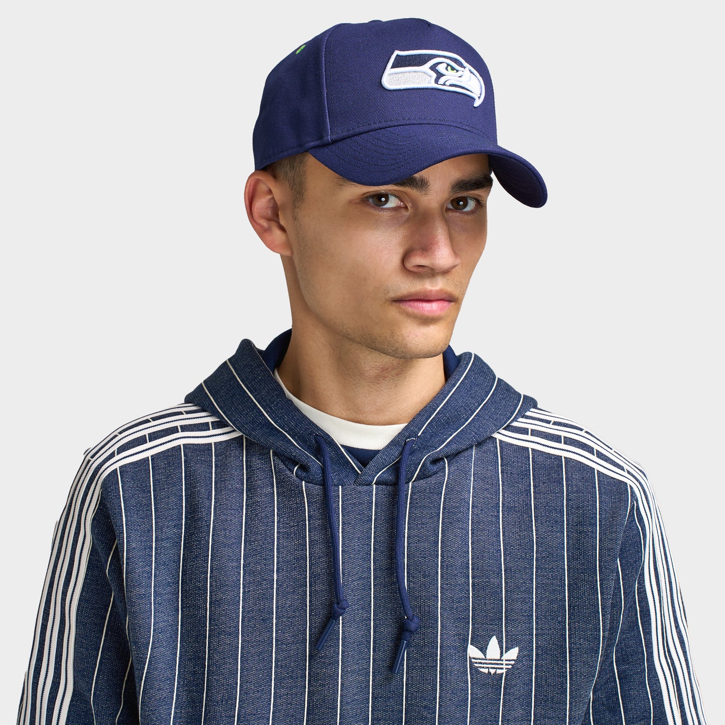 New Era Seattle Seahawks 9FORTY AF. Front view of model wearing navy cap with curved brim and white Seattle Seahawks logo.