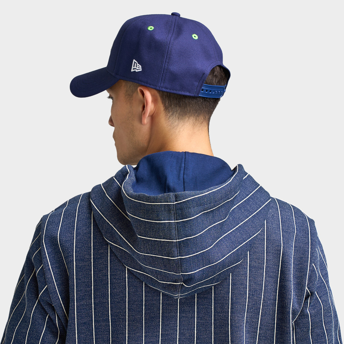 New Era Seattle Seahawks 9FORTY AF. Back view of model wearing navy cap with adjustable closure and structured crown.