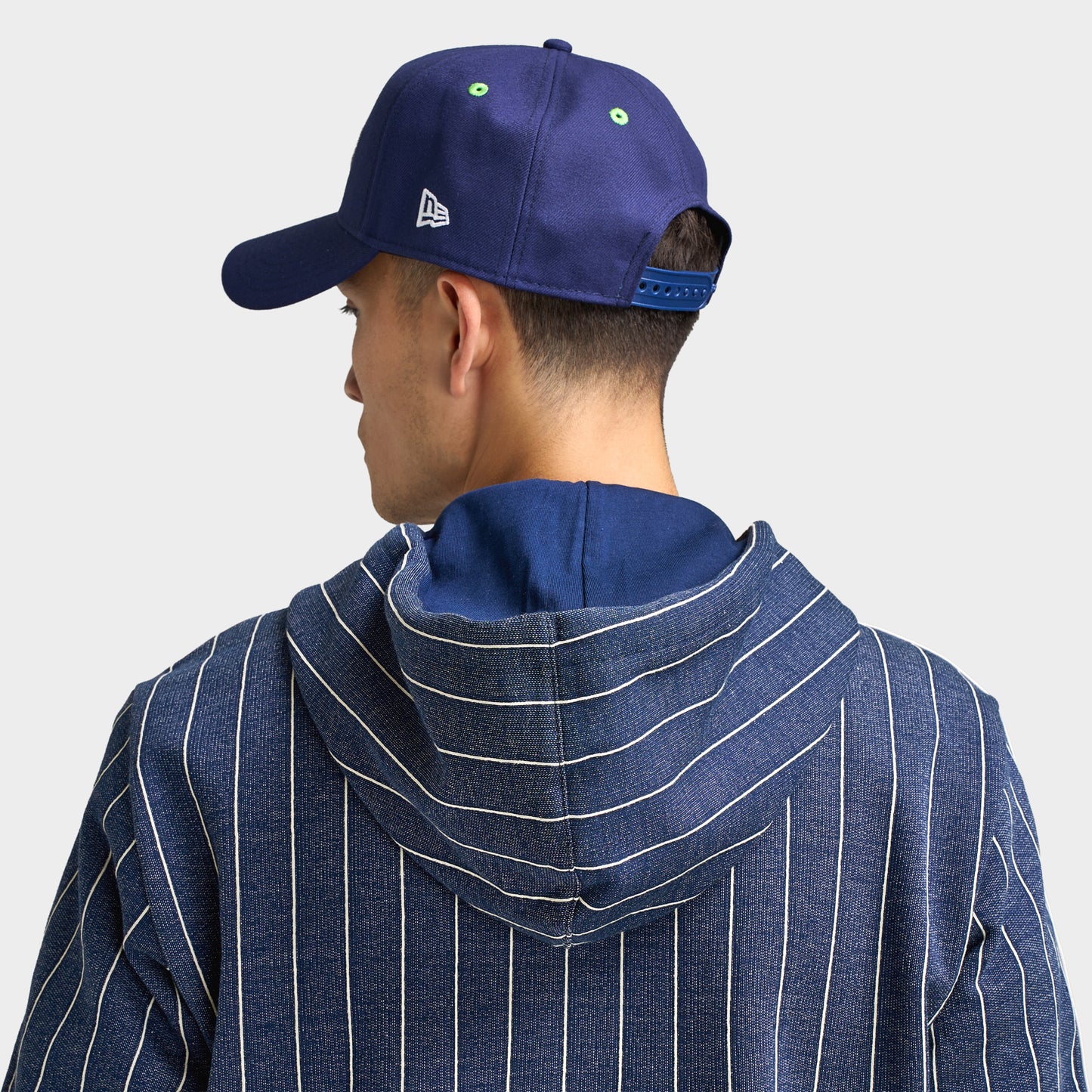 New Era Seattle Seahawks 9FORTY AF. Back view of model wearing navy cap with adjustable closure and structured crown.