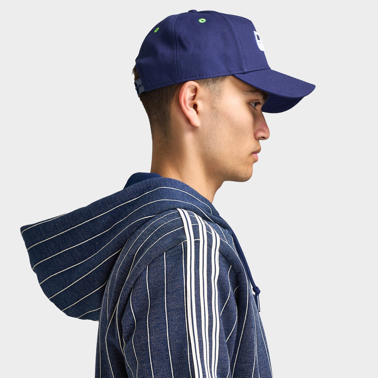 New Era Seattle Seahawks 9FORTY AF. Side view of model wearing navy cap with curved brim and structured profile.